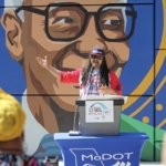 Artist Sike Style, speaking at Mural Reveal event.